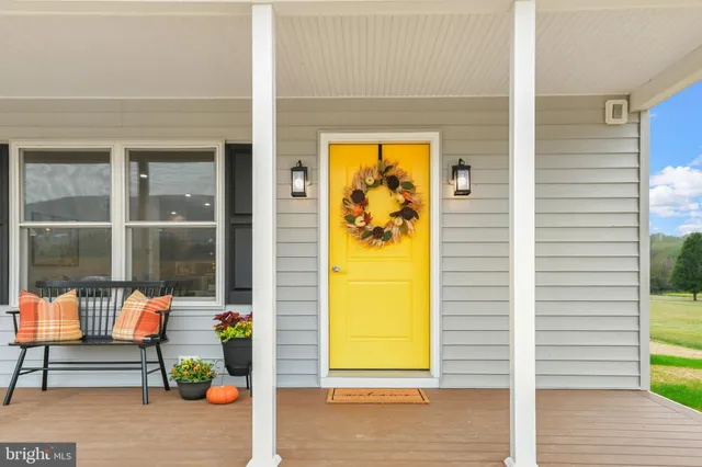 a view of a two chairs in the balcony