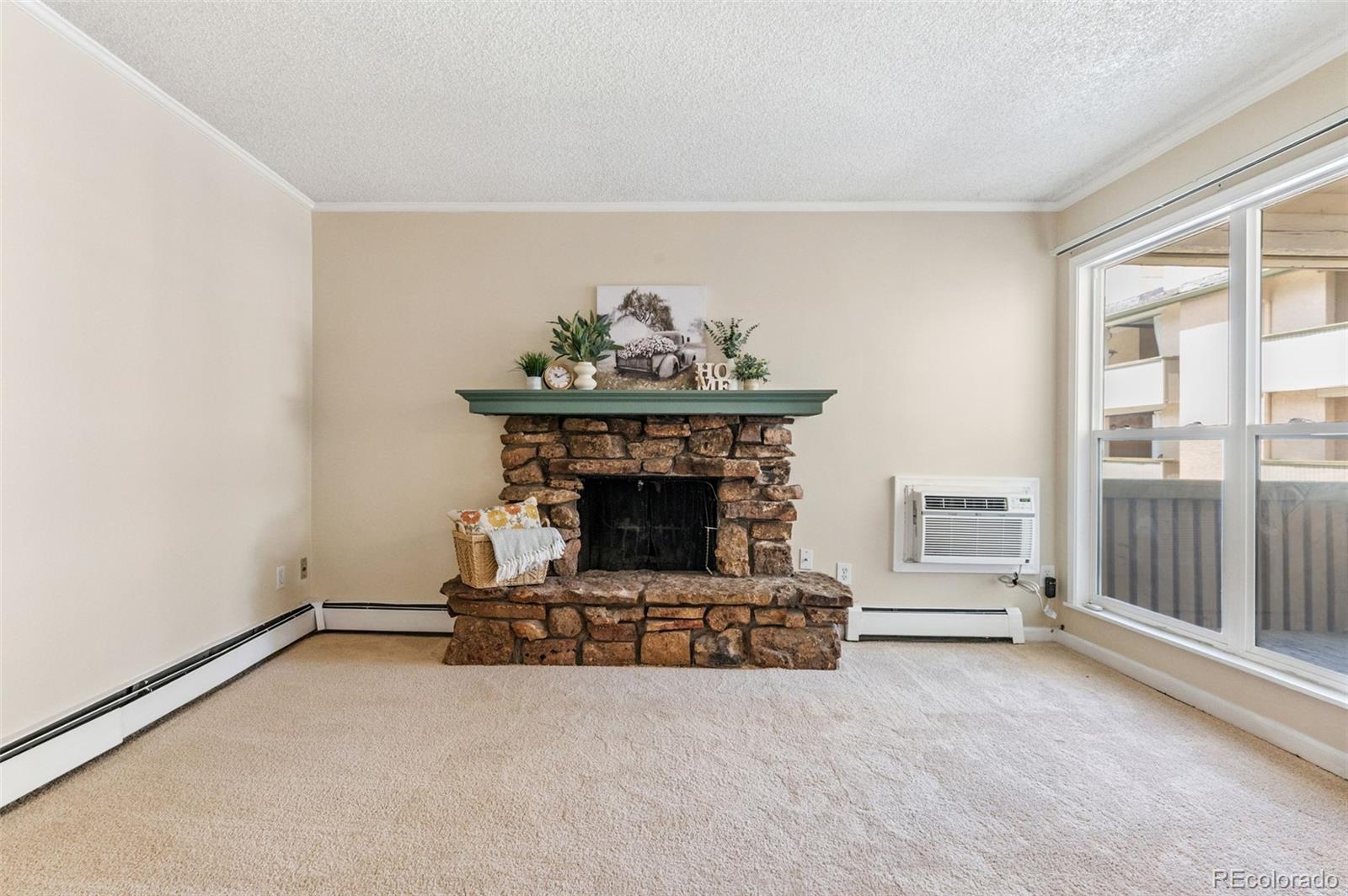 3035 Oneal Parkway, Unit 37V Boulder, CO 80301 - Photo 16 of 49 a living room with furniture and a fireplace