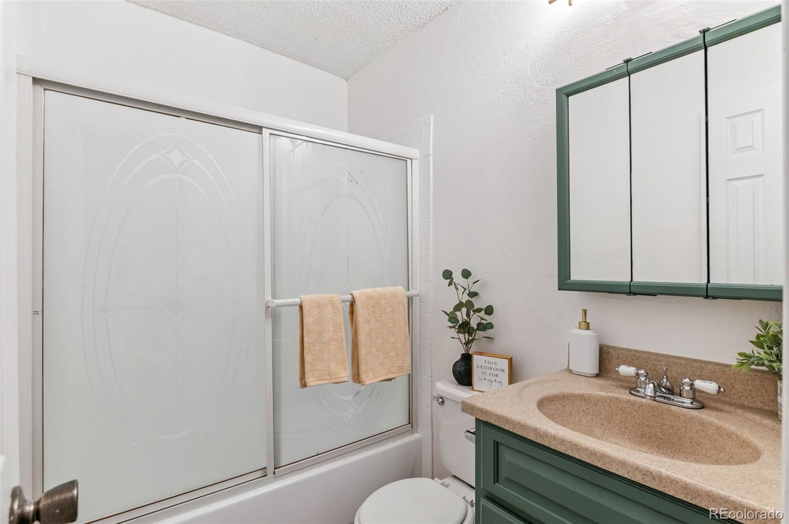 3035 Oneal Parkway, Unit 37V Boulder, CO 80301 - Photo 26 of 49 a bathroom with a sink and a mirror