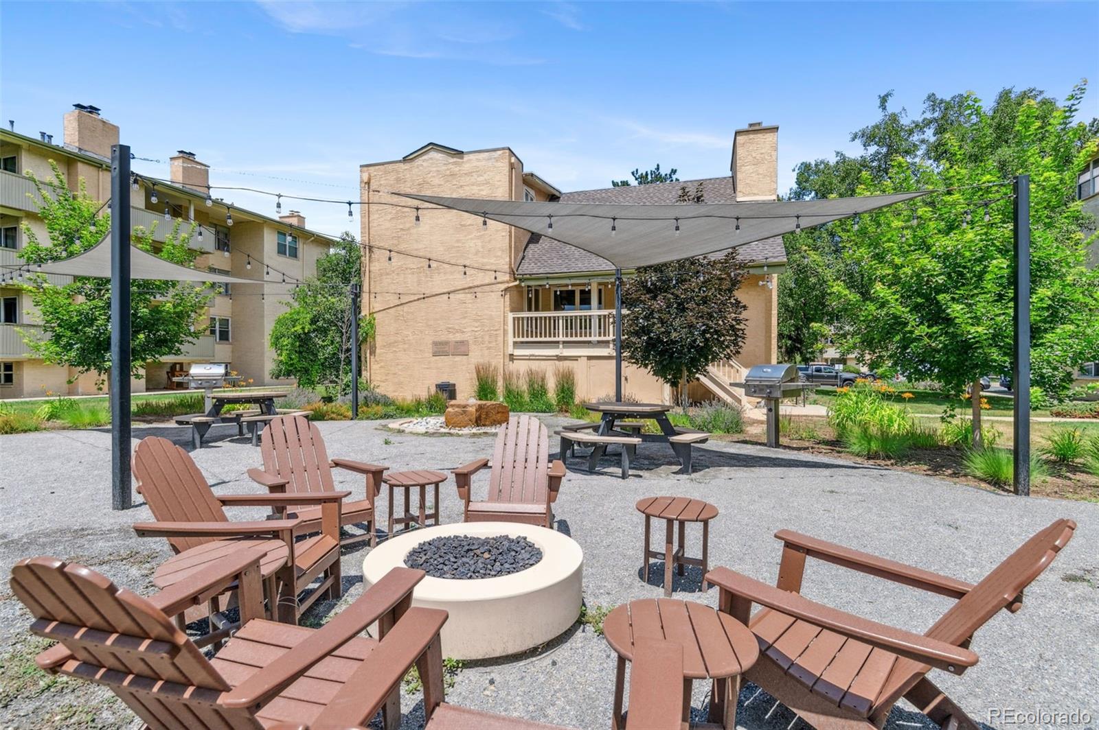 3035 Oneal Parkway, Unit 37V Boulder, CO 80301 - Photo 37 of 49 a view of a patio with couches table and chairs and potted plants