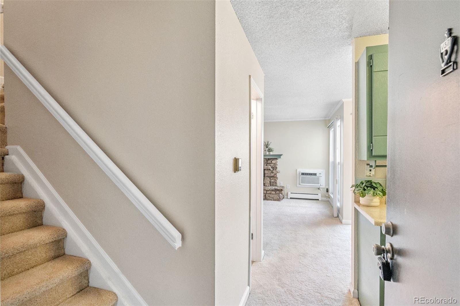 3035 Oneal Parkway, Unit 37V Boulder, CO 80301 - Photo 6 of 49 a view of an entryway with wooden floor