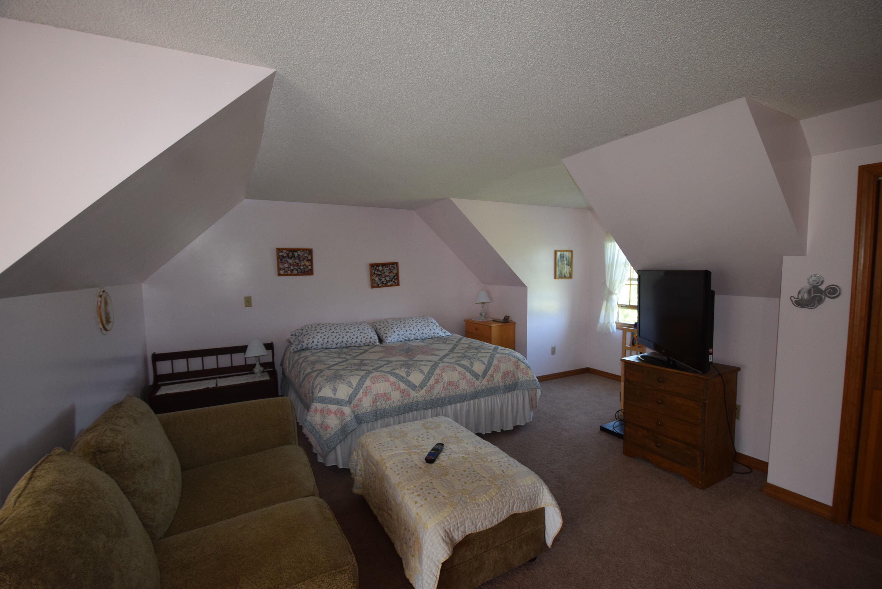 657 Golden Ridge Road Sherman, ME 04776 - Photo 31 of 43 Second level bedroom, eave storage...