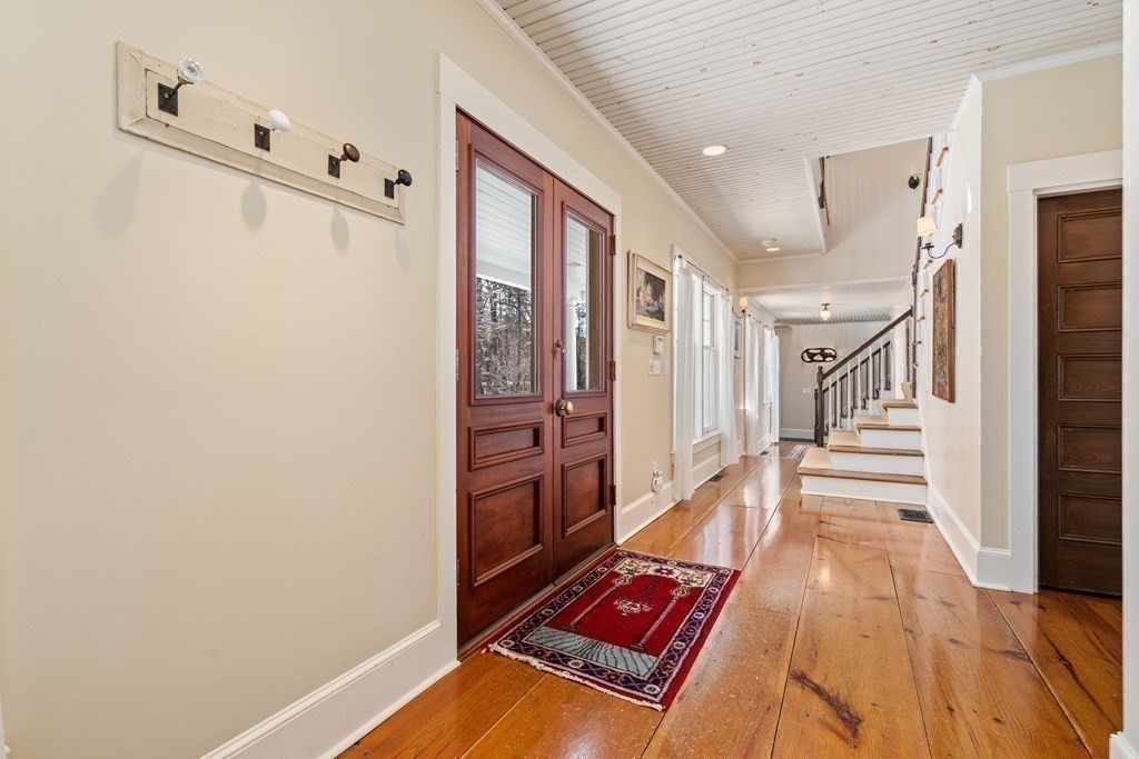 9 Lantern Lane Natick, MA 01760 - Photo 11 of 42 a view of a hallway with seating area