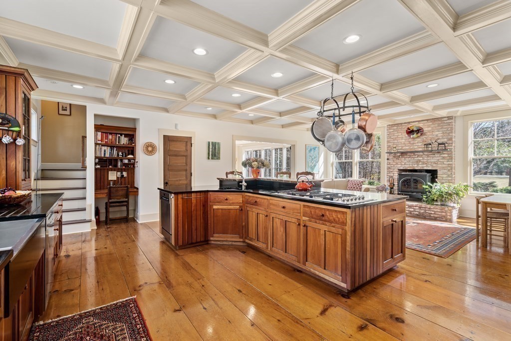 9 Lantern Lane Natick, MA 01760 - Photo 15 of 42 a large kitchen with a large counter top appliances and cabinets