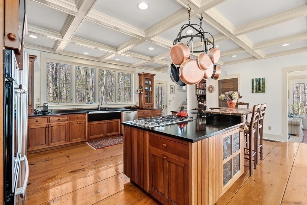 9 Lantern Lane Natick, MA 01760 - Photo 16 of 42 a kitchen with stainless steel appliances granite countertop a sink and cabinets