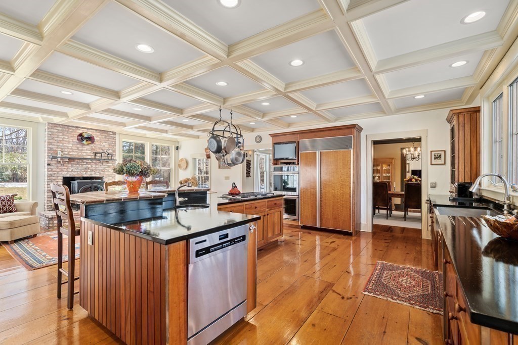 9 Lantern Lane Natick, MA 01760 - Photo 17 of 42 a kitchen with stainless steel appliances granite countertop lots of counter top space