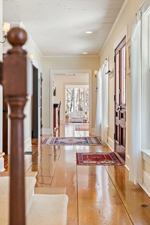 9 Lantern Lane Natick, MA 01760 - Photo 19 of 42 a living room with furniture and large windows