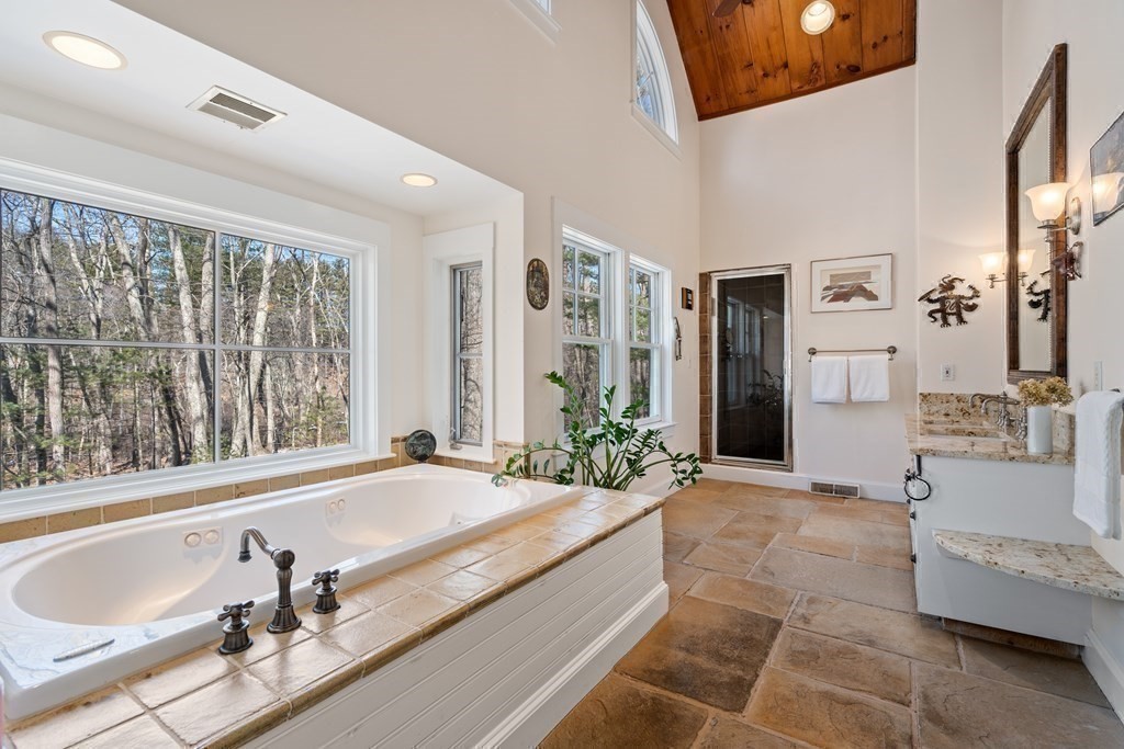 9 Lantern Lane Natick, MA 01760 - Photo 22 of 42 a spacious bathroom with sink shower and mirror