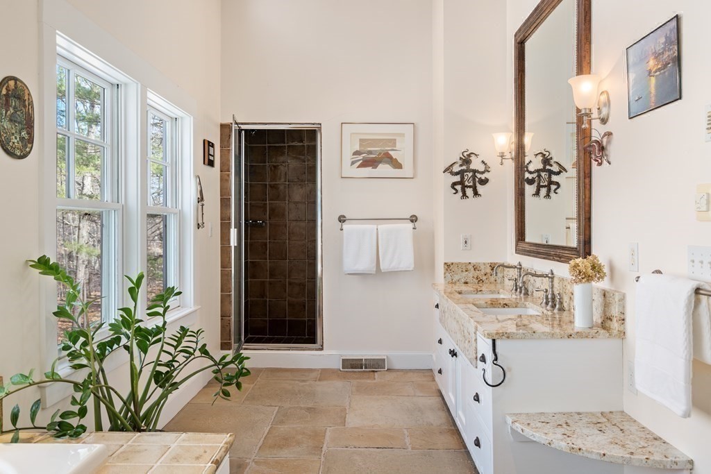 9 Lantern Lane Natick, MA 01760 - Photo 23 of 42 a bathroom with a sink and a mirror