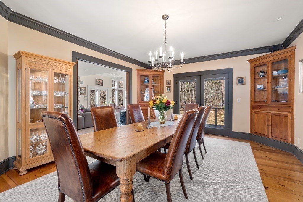 9 Lantern Lane Natick, MA 01760 - Photo 9 of 42 a view of a dining room with furniture window and wooden floor