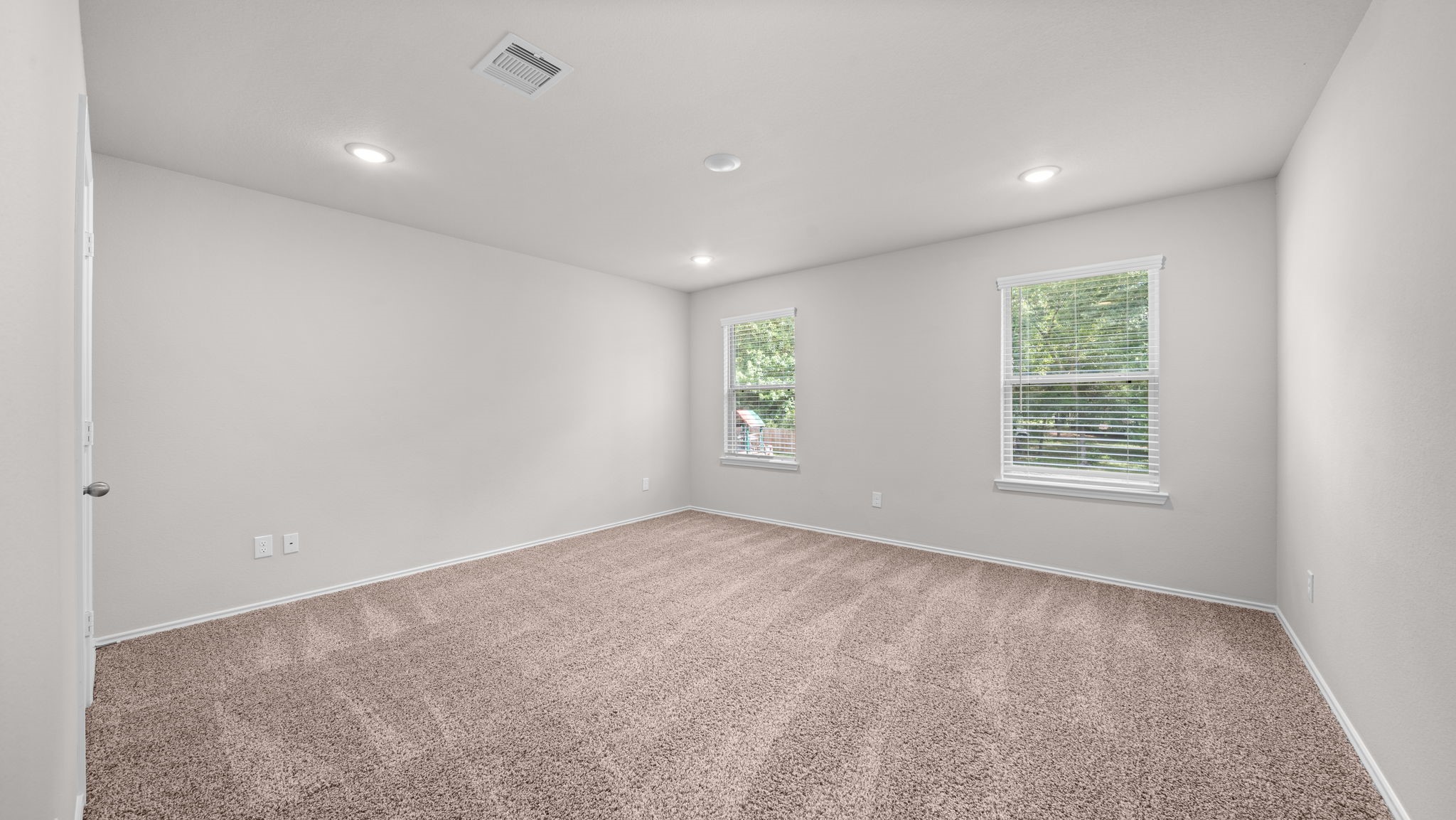 18140 Mail Rte Road Montgomery, TX 77316 - Photo 18 of 26 This versatile bedroom offers a spacious layout, neutral finishes, and large windows that fill the room with natural light.