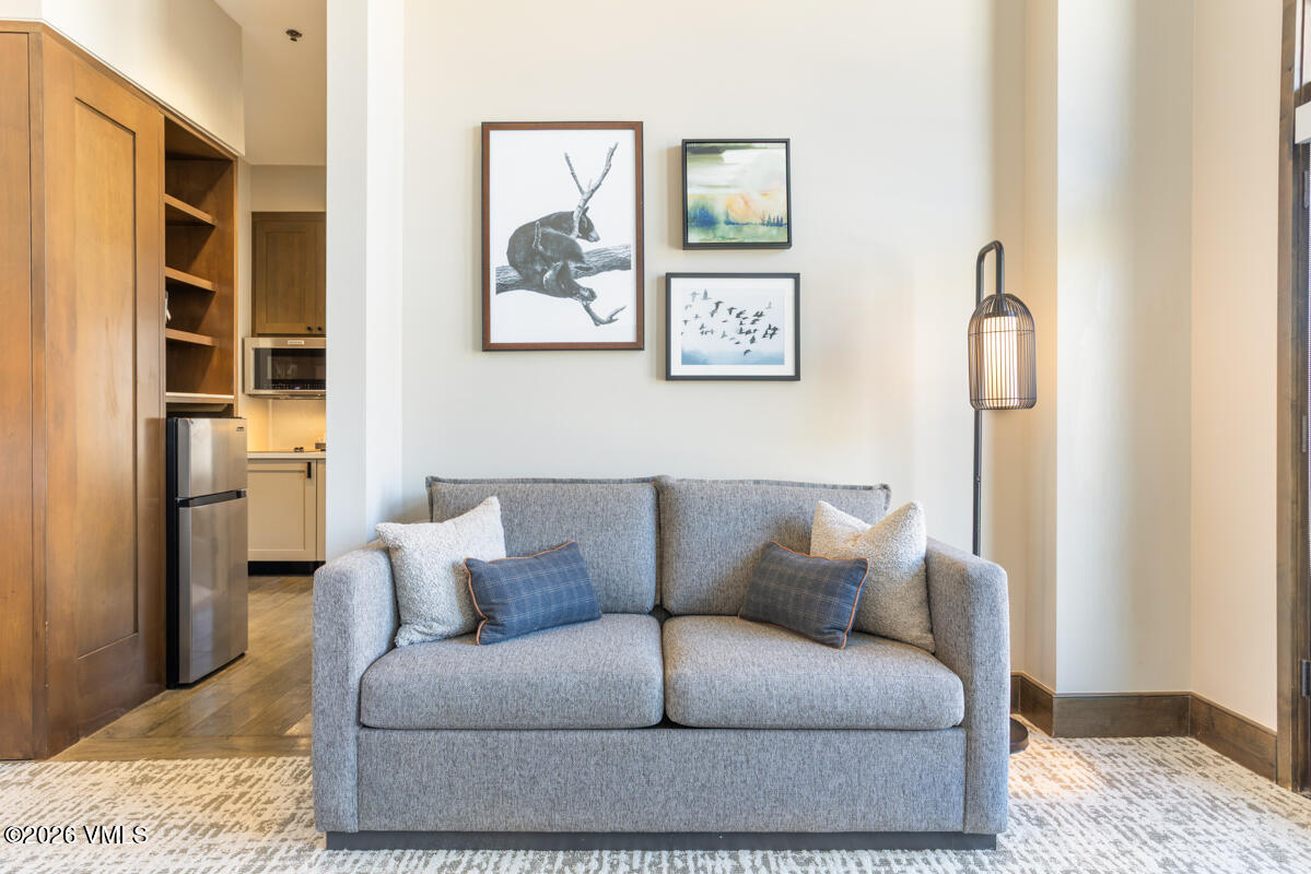 126 Riverfront Lane, Unit 912 Avon, CO 81620 - Photo 15 of 28 a living room with furniture and a rug