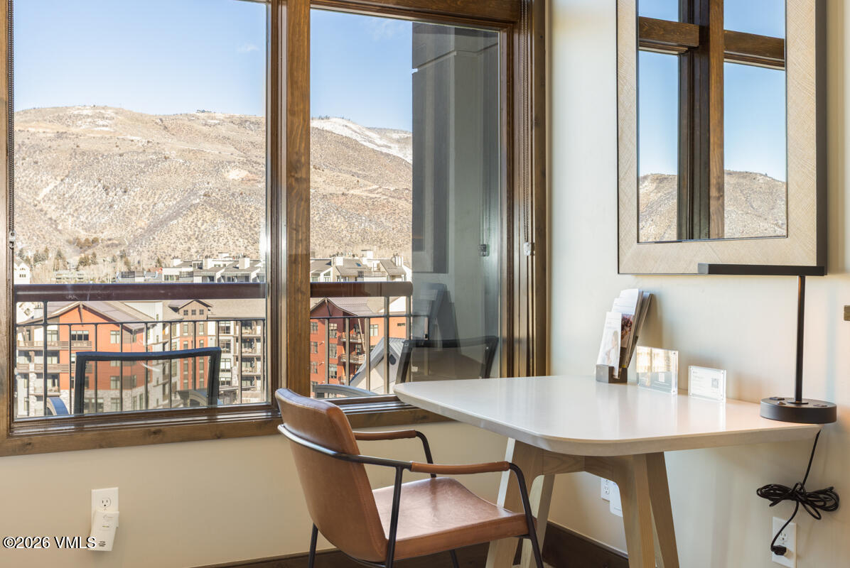 126 Riverfront Lane, Unit 912 Avon, CO 81620 - Photo 17 of 28 a view of a dining room with furniture window and outside view