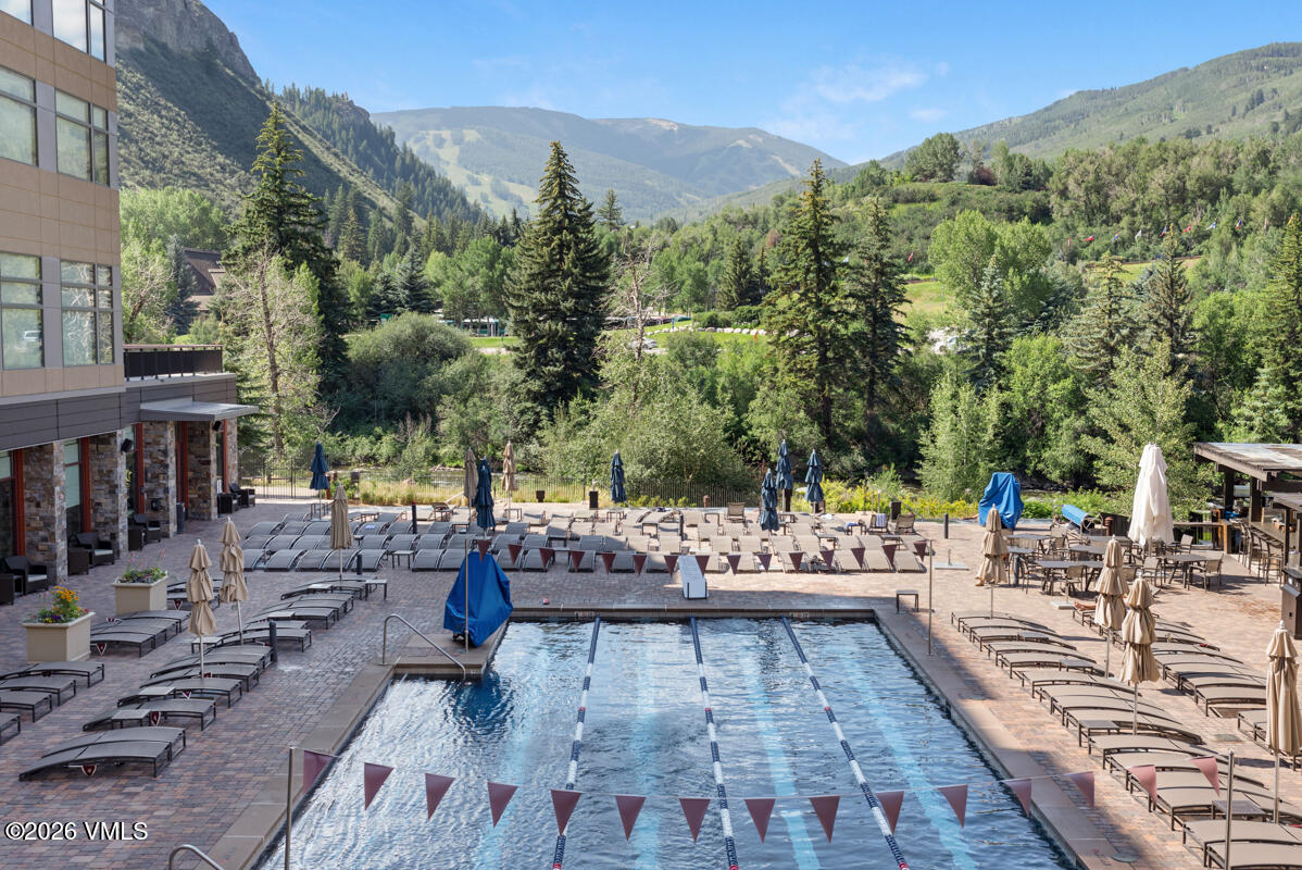 126 Riverfront Lane, Unit 912 Avon, CO 81620 - Photo 7 of 28 a view of a swimming pool with lounge chair