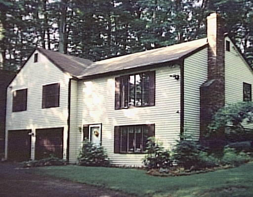 502 Main Street Boxford, MA 01921 - Photo 1 of 1 a front view of house with yard and green space