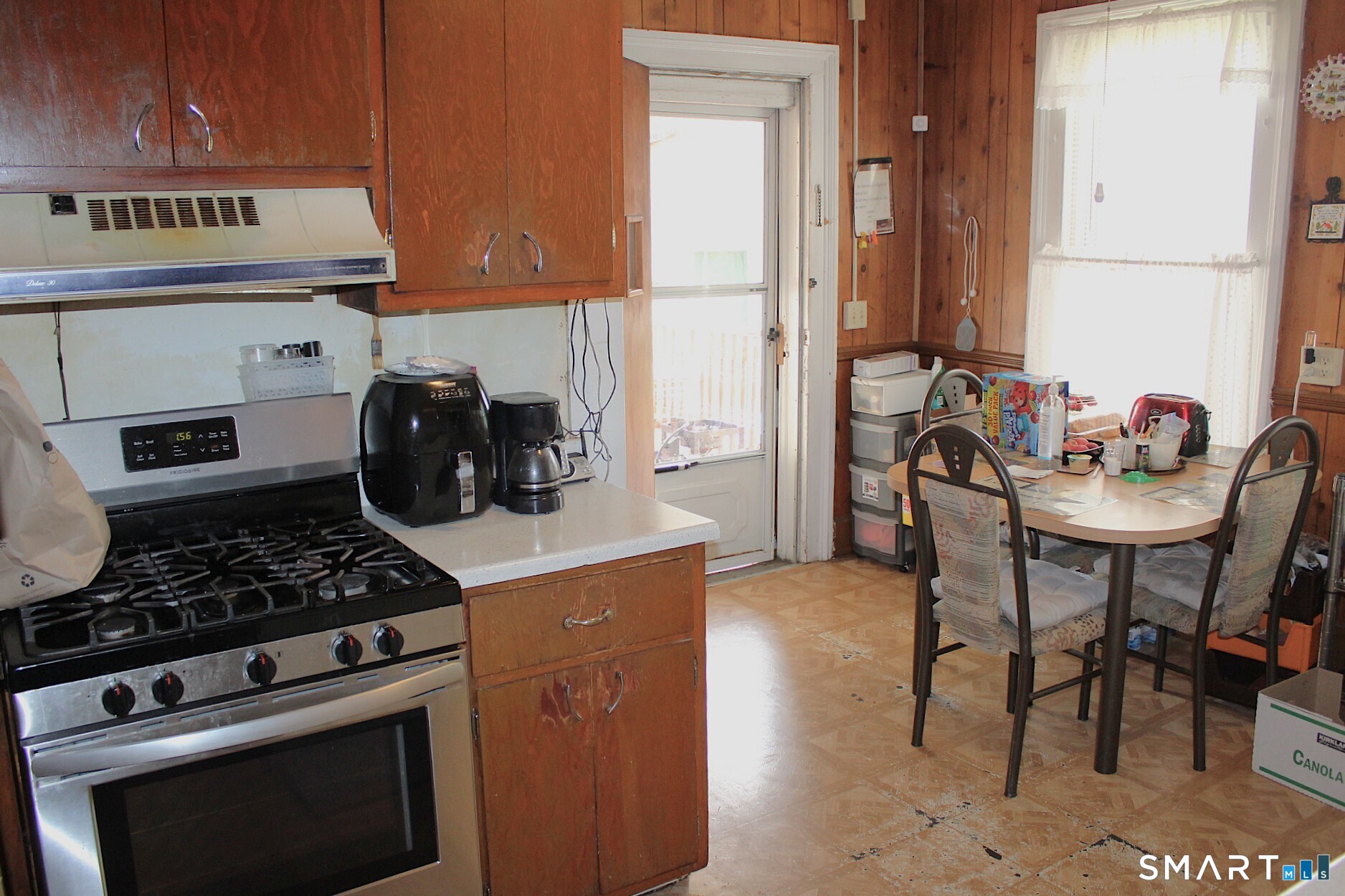 90 Franklin Street Meriden, CT 06450 - Photo 11 of 40 a kitchen with a stove and a refrigerator