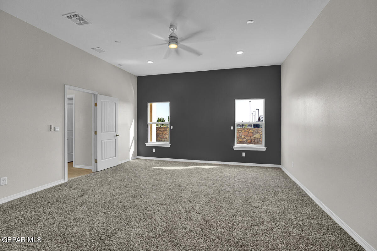 6935 Levee Circle El Paso, TX 79932 - Photo 15 of 32 a view of an empty room with windows and closet