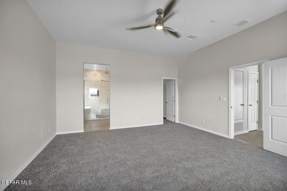 6935 Levee Circle El Paso, TX 79932 - Photo 16 of 32 a view of an empty room and a ceiling fan