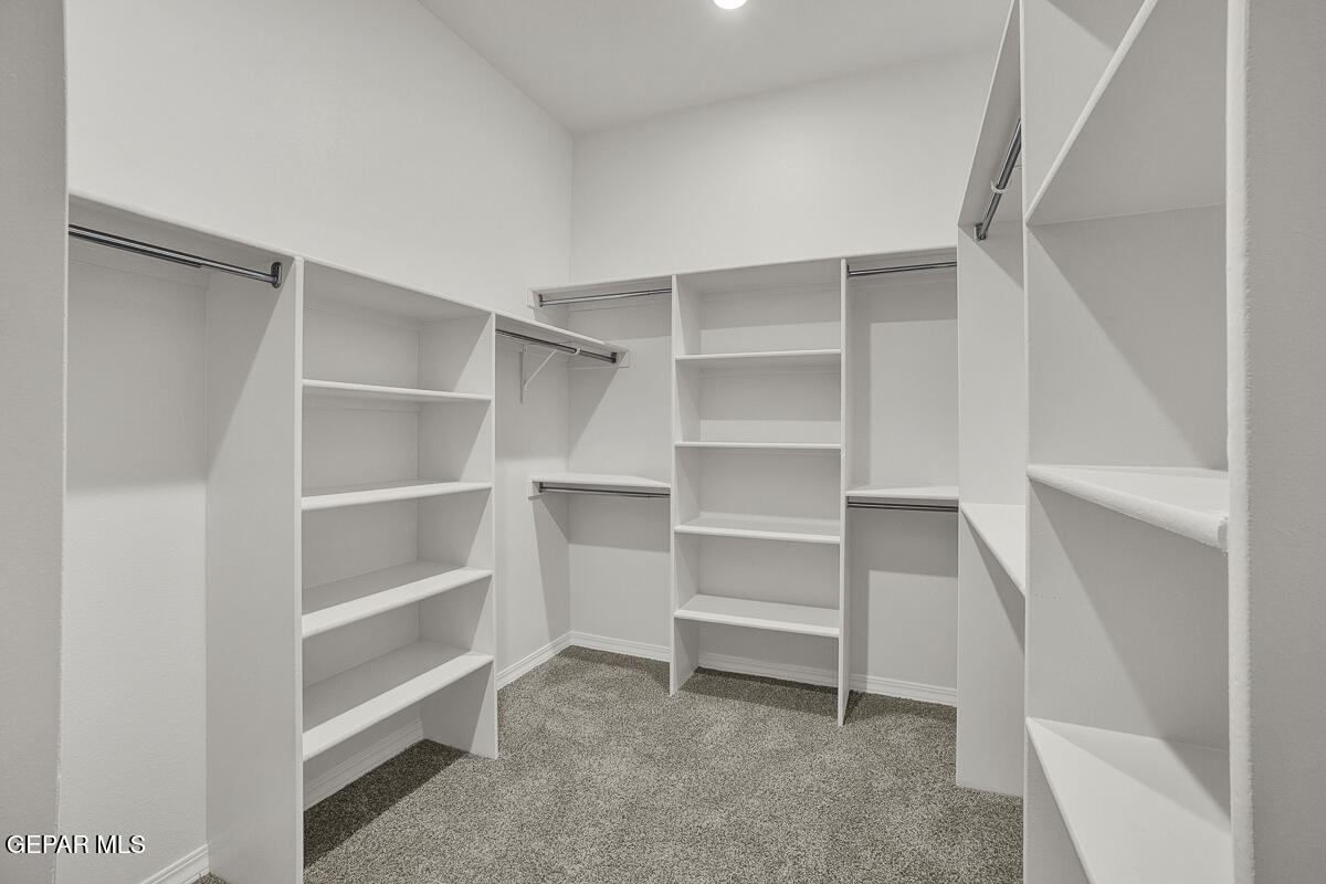 6935 Levee Circle El Paso, TX 79932 - Photo 17 of 32 a view of walk in closet with empty racks