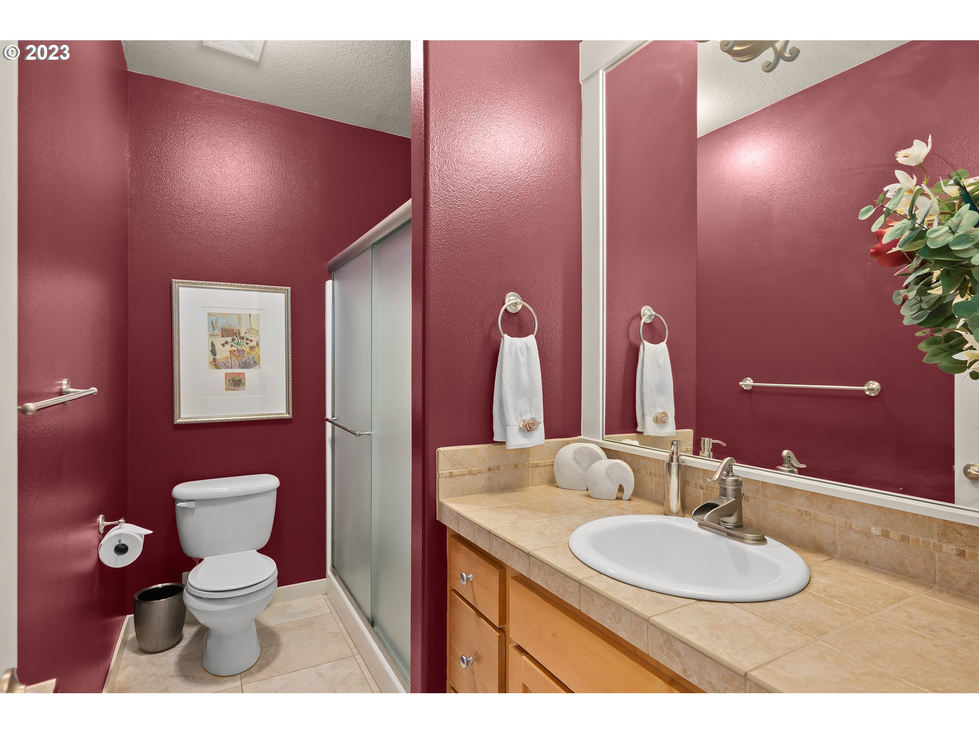 8964 Southwest Taylors Ferry Road Portland, OR 97223 - Photo 16 of 32 a bathroom with a toilet sink and mirror
