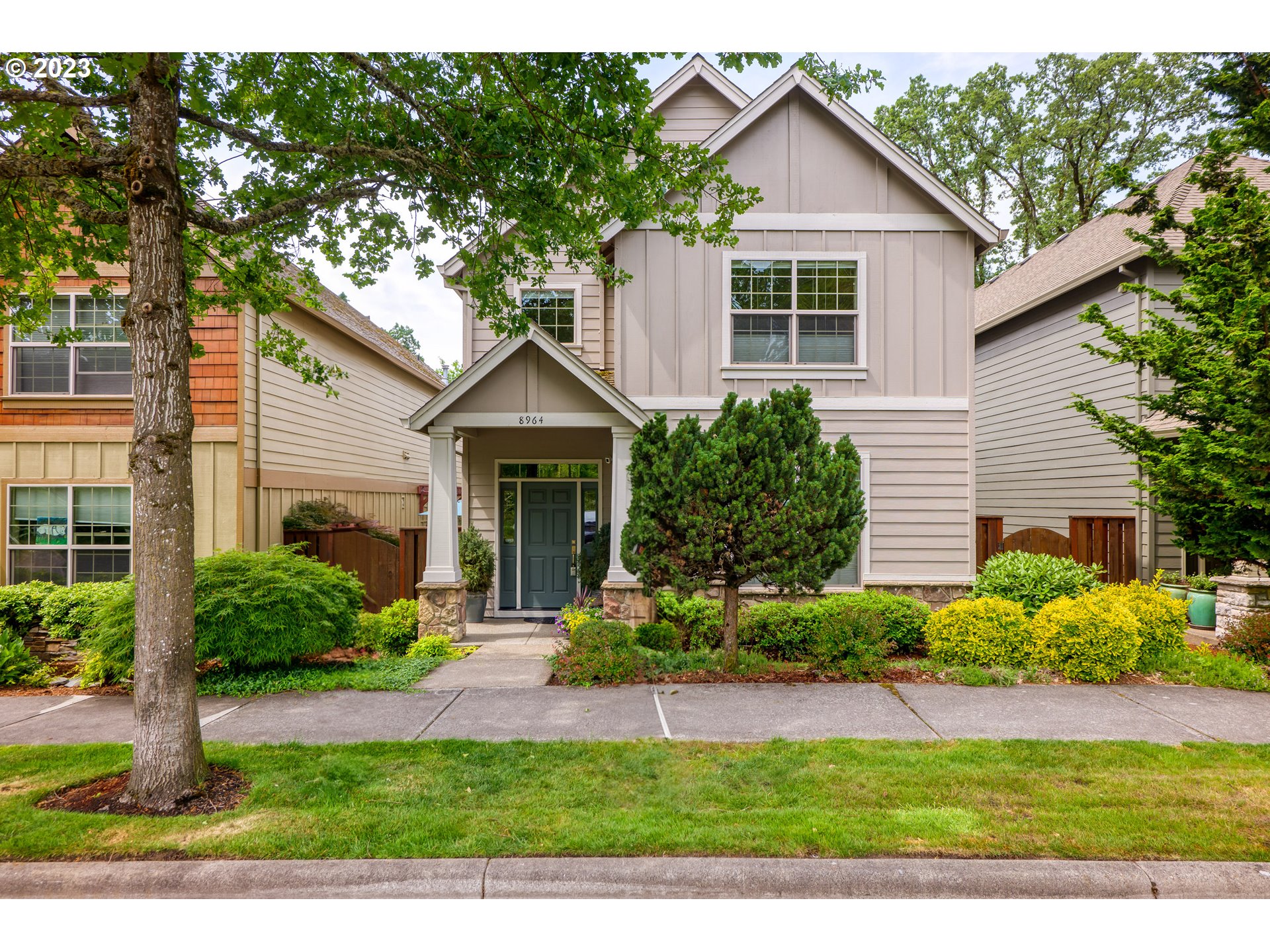 8964 Southwest Taylors Ferry Road Portland, OR 97223 - Photo 2 of 32 a view of a house with a yard and potted plants