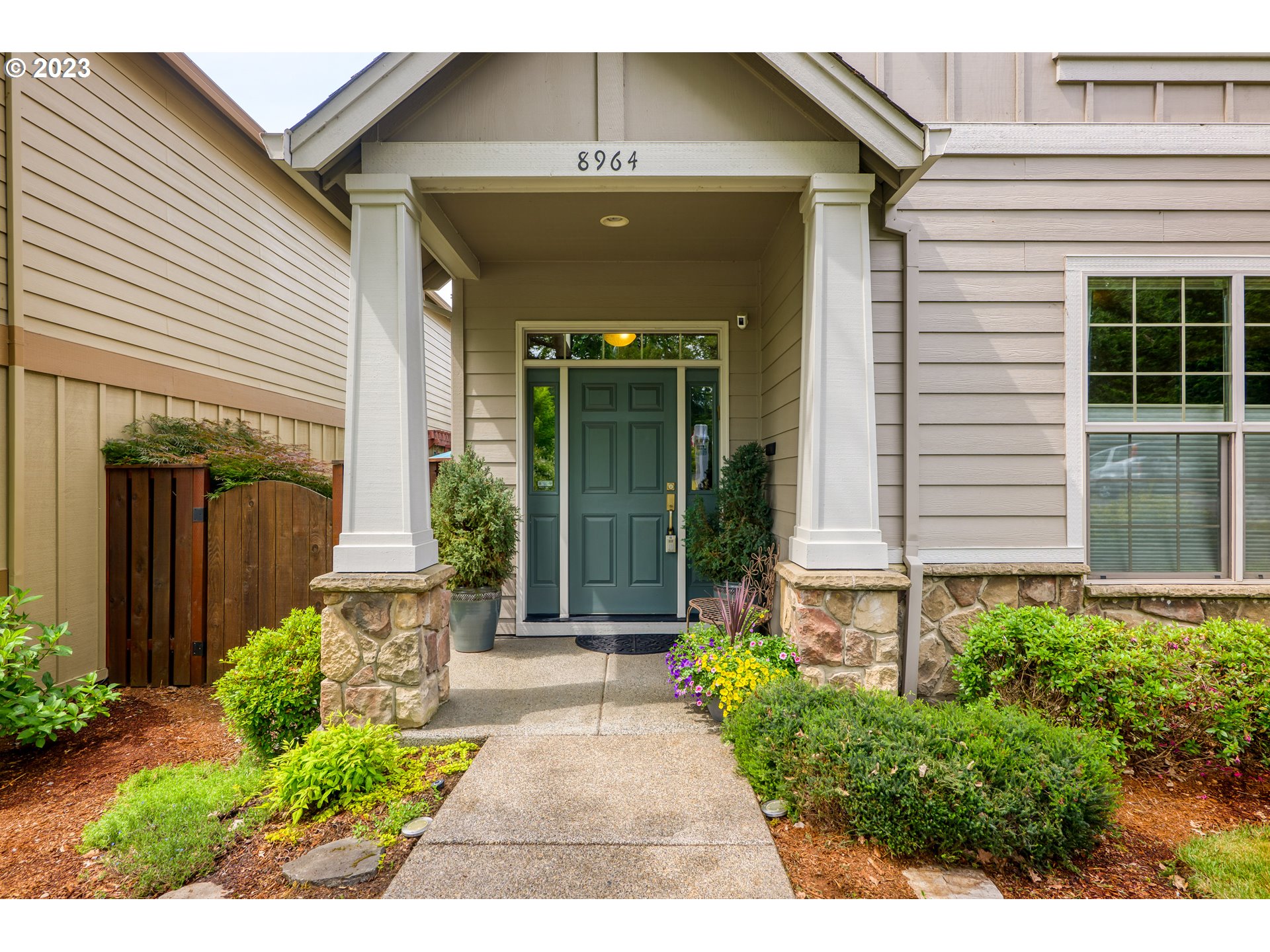 8964 Southwest Taylors Ferry Road Portland, OR 97223 - Photo 4 of 32 a front view of a house with a yard