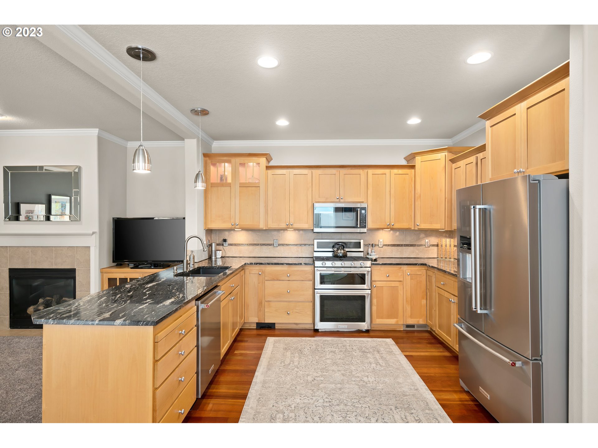 8964 Southwest Taylors Ferry Road Portland, OR 97223 - Photo 7 of 32 a kitchen with stainless steel appliances granite countertop a refrigerator stove and sink