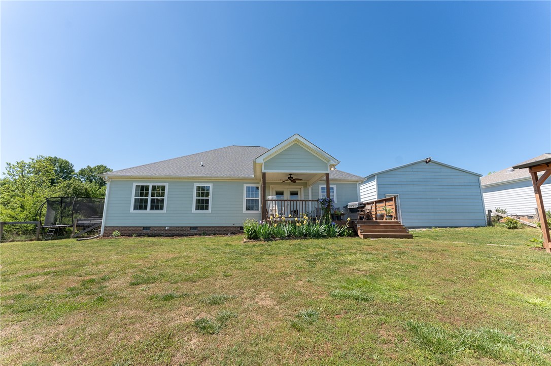 696 Mt Olivet Road Six Mile, SC 29682 - Photo 23 of 35 This residence offers a tranquil backyard with a charming covered porch and an inviting deck.