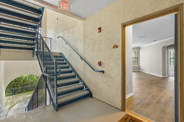a view of a hallway with staircase
