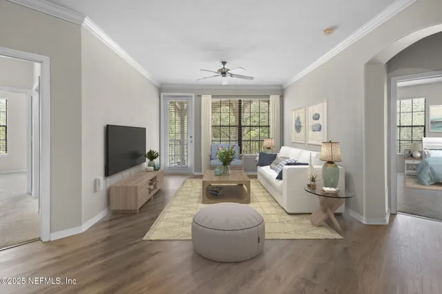 a living room with furniture and a flat screen tv