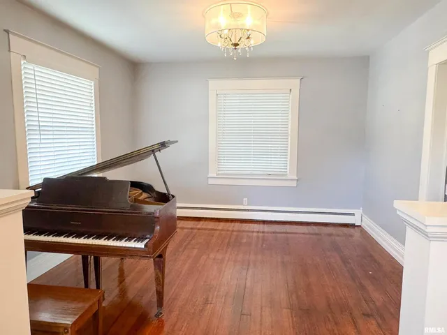 a kitchen with granite countertop a refrigerator and a stove top oven