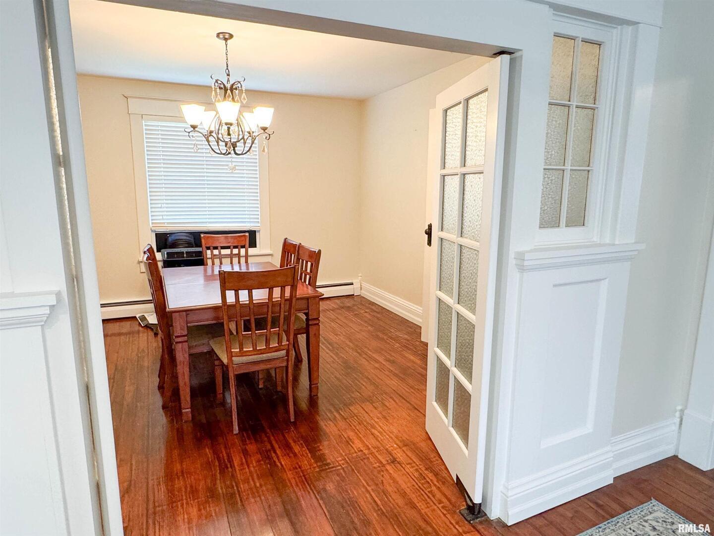 102 Southeast Front Street Dongola, IL 62926 - Photo 23 of 83 a view of a dining room with furniture and wooden floor