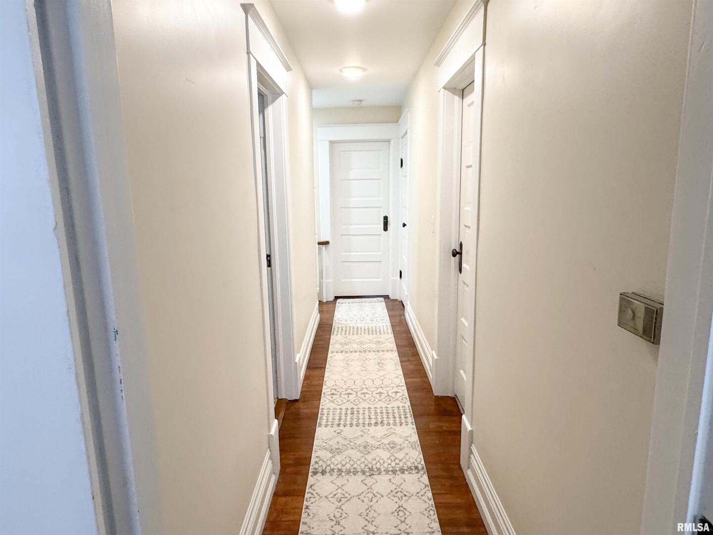 102 Southeast Front Street Dongola, IL 62926 - Photo 37 of 78 a view of a hallway with wooden floor and a bathroom