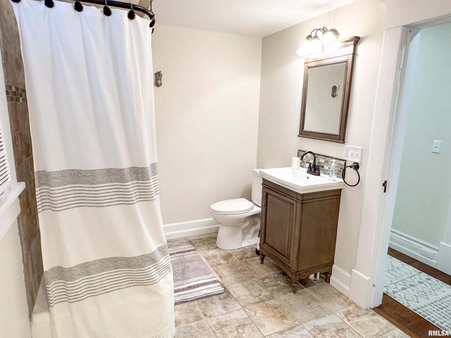 102 Southeast Front Street Dongola, IL 62926 - Photo 51 of 83 a bathroom with a sink toilet and shower