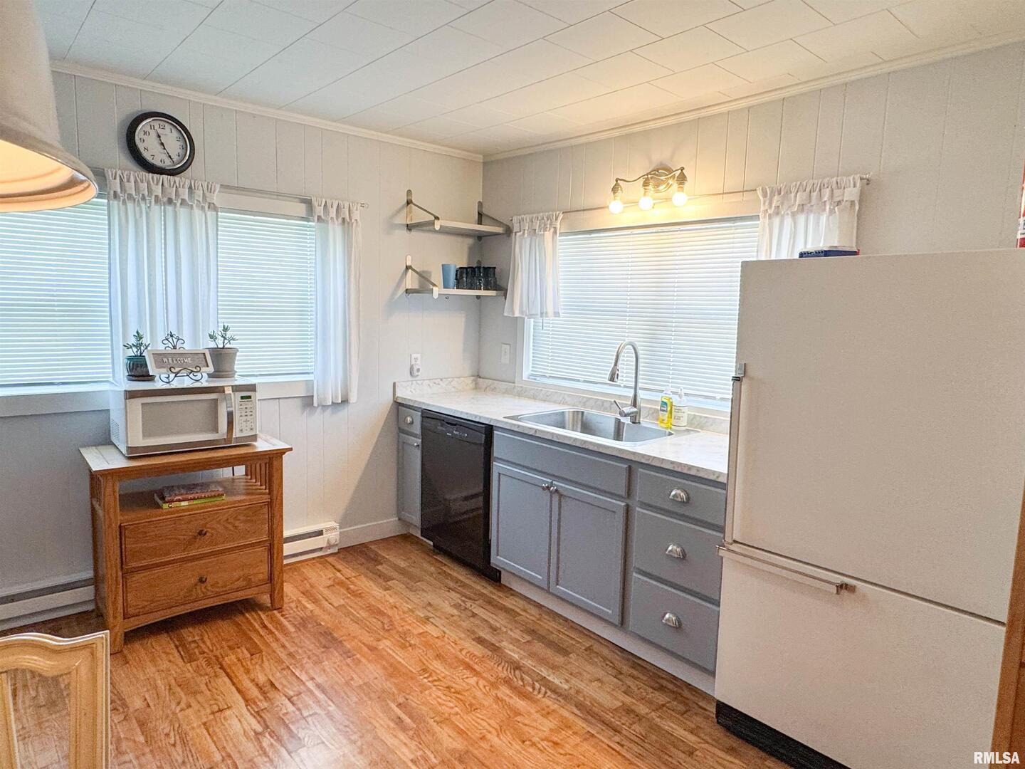 102 Southeast Front Street Dongola, IL 62926 - Photo 62 of 83 a kitchen with stainless steel appliances granite countertop a sink stove and refrigerator