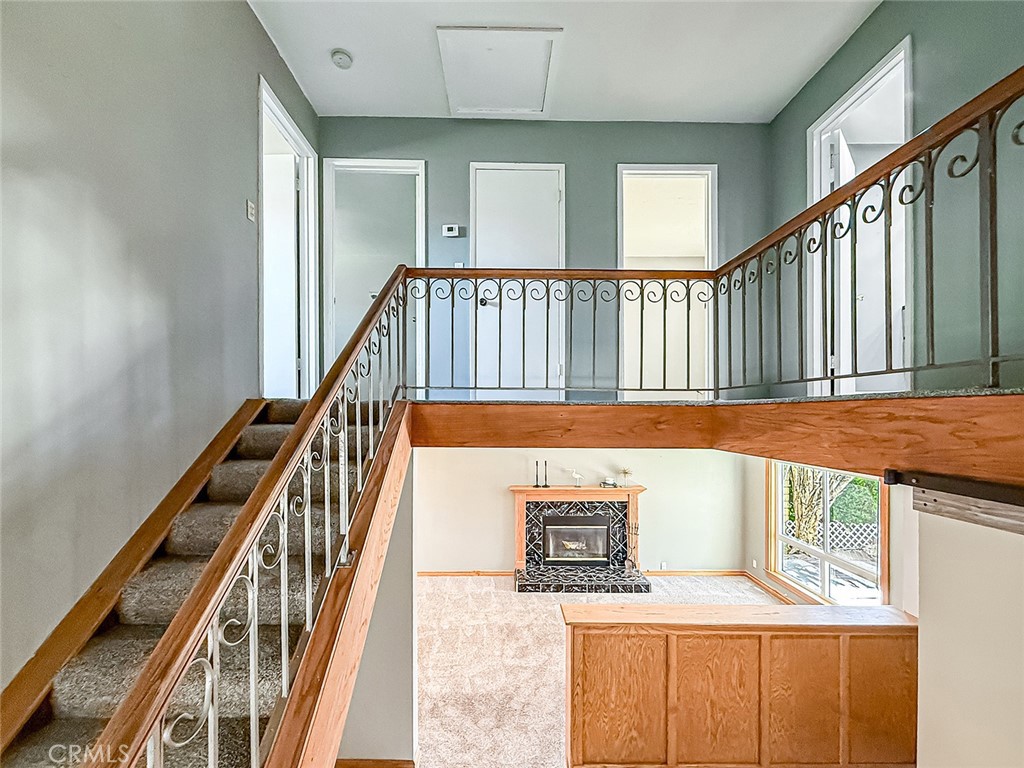 2235 Burnside Street Simi Valley, CA 93065 - Photo 30 of 71 a view of a hallway with wooden floor and staircase
