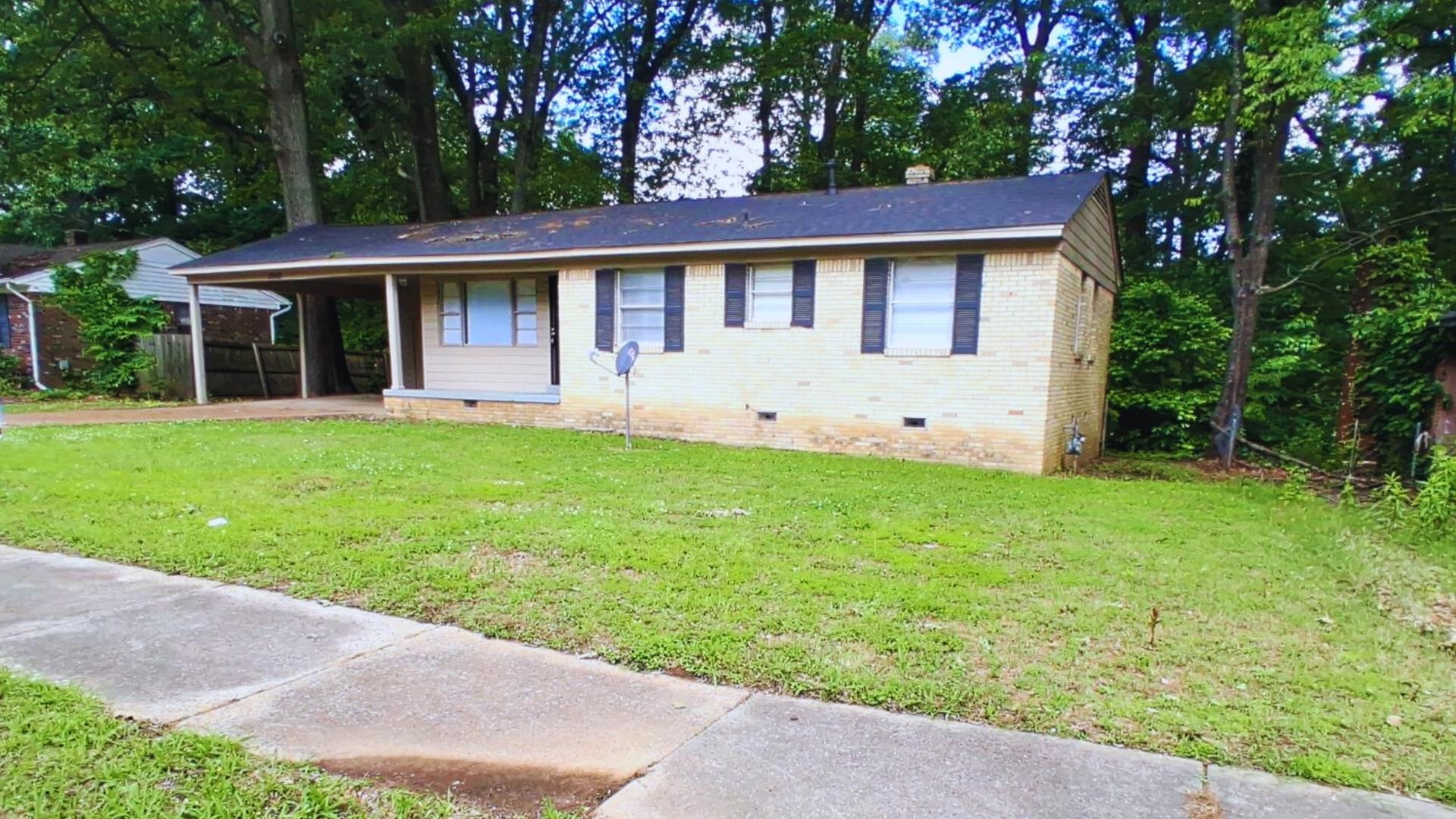 front view of a house with a yard