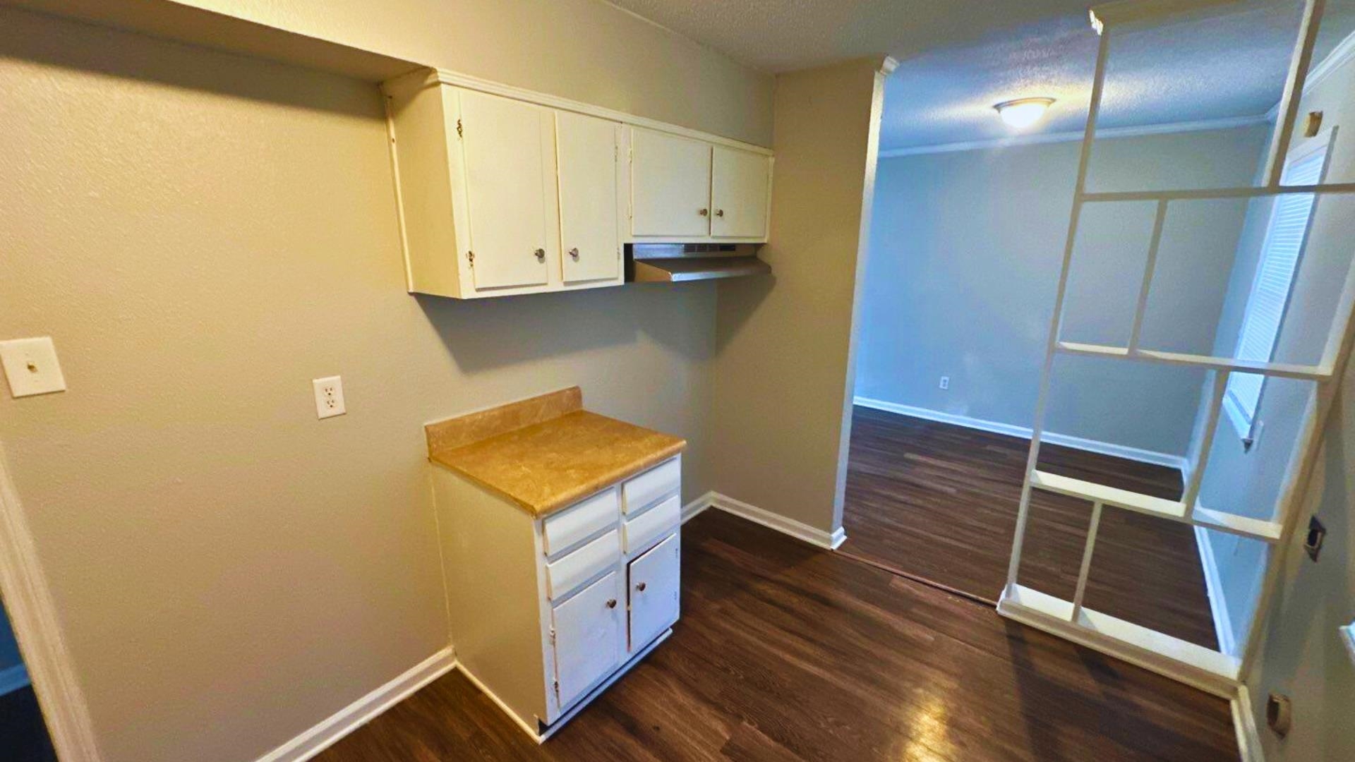 3969 Ridgedale Street Memphis, TN 38127 - Photo 4 of 11 a view of washer and dryer with wooden floor