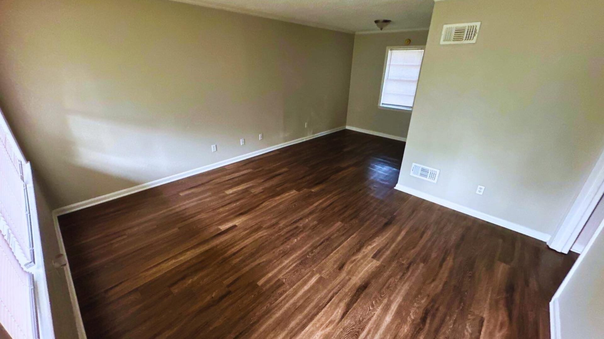 3969 Ridgedale Street Memphis, TN 38127 - Photo 7 of 11 an empty room with wooden floor