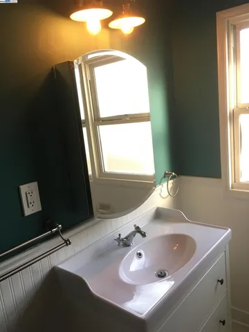 a bathroom with a sink and a window