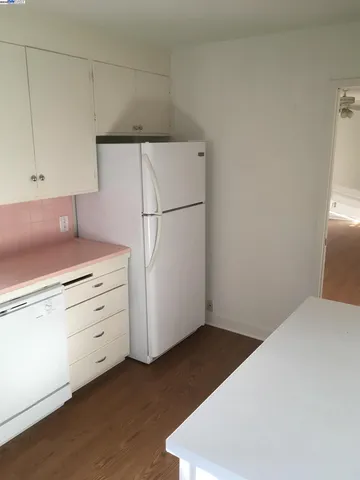 a kitchen with cabinets appliances