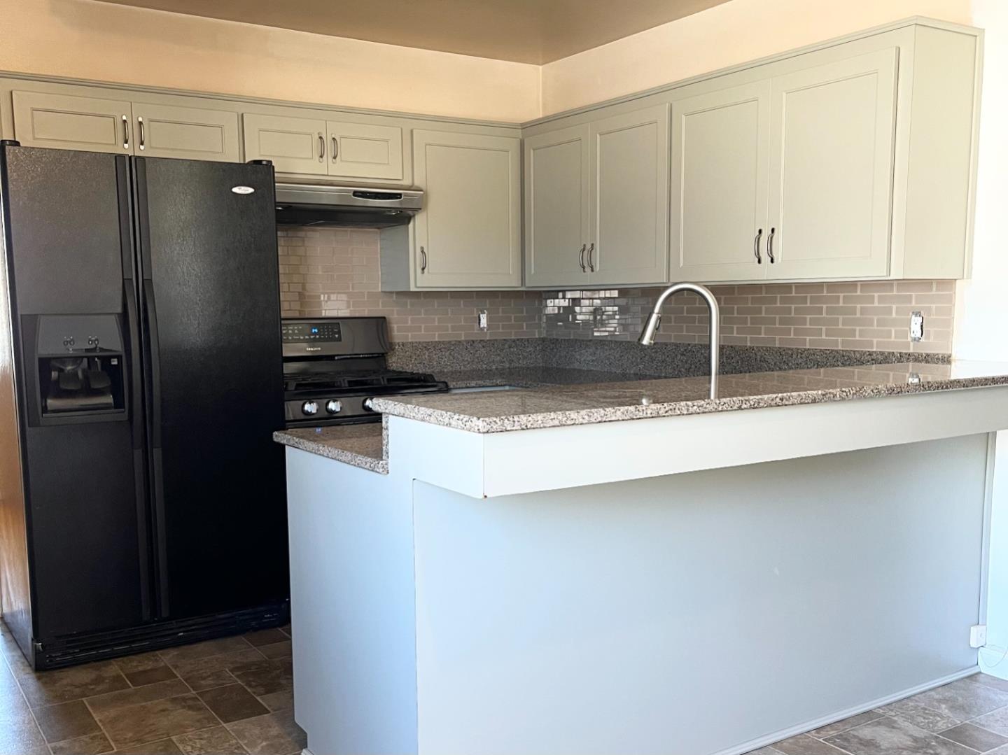414 Crescent Way Salinas, CA 93906 - Photo 5 of 21 a kitchen with a refrigerator and a sink