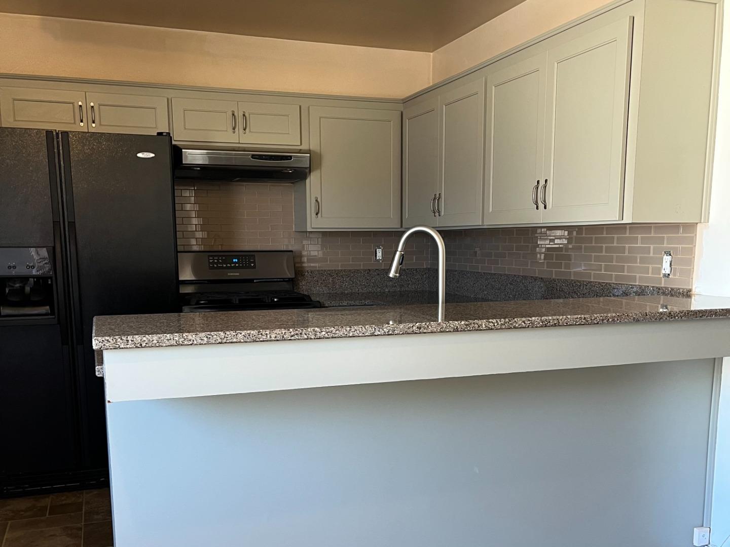 414 Crescent Way Salinas, CA 93906 - Photo 6 of 21 a kitchen with a sink a stove and a refrigerator