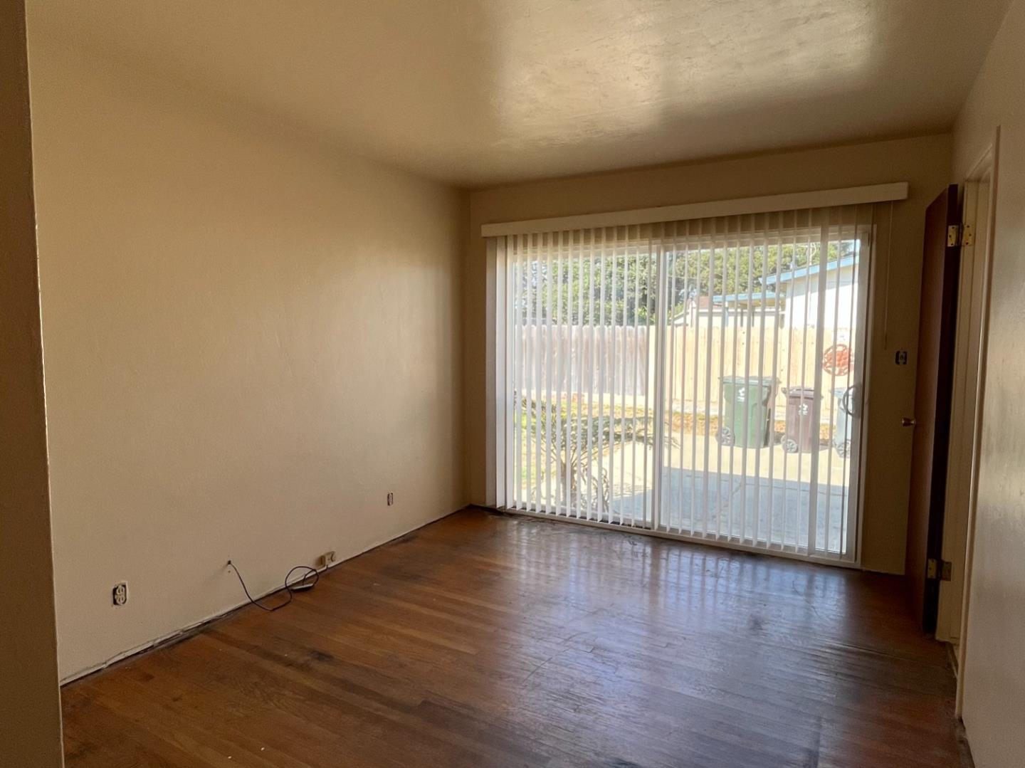 414 Crescent Way Salinas, CA 93906 - Photo 10 of 21 a view of an empty room with wooden floor and a window