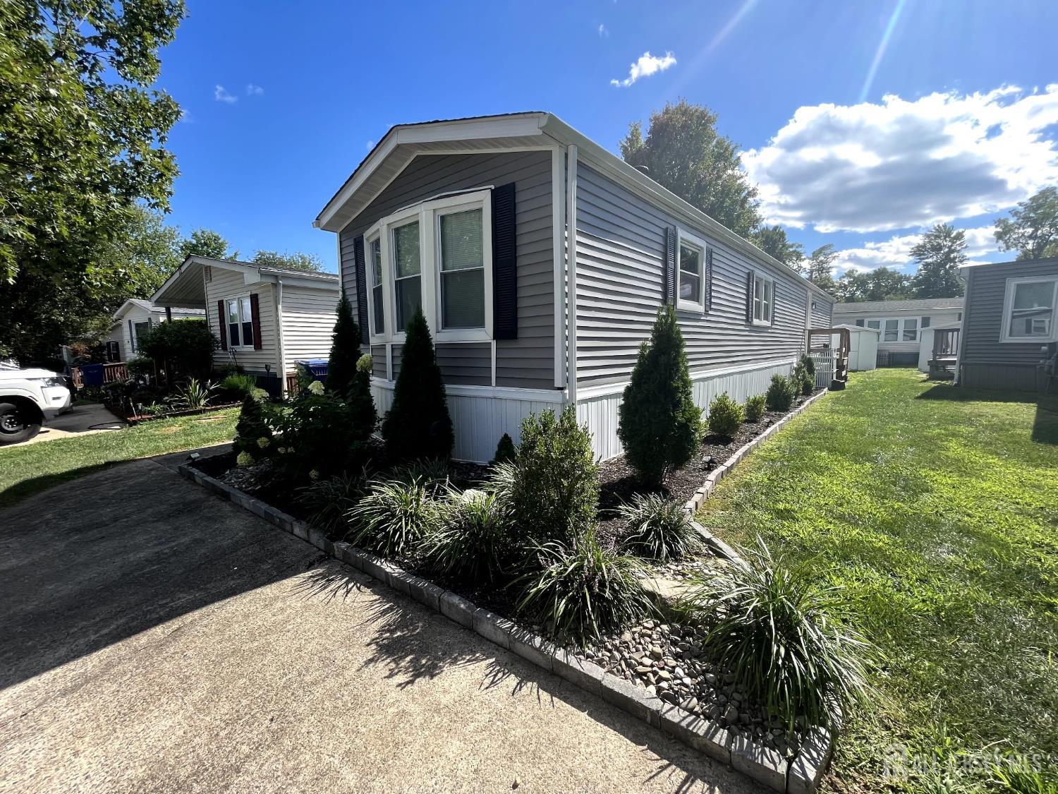 14 Byron Road North Brunswick, NJ 08902 - Photo 1 of 27 a front view of a house with garden