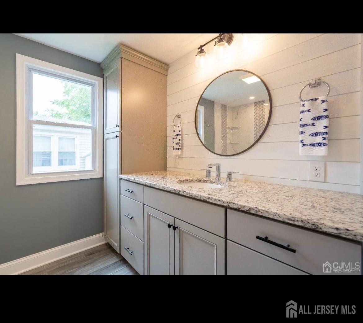 14 Byron Road North Brunswick, NJ 08902 - Photo 12 of 27 a bathroom with a sink and a mirror