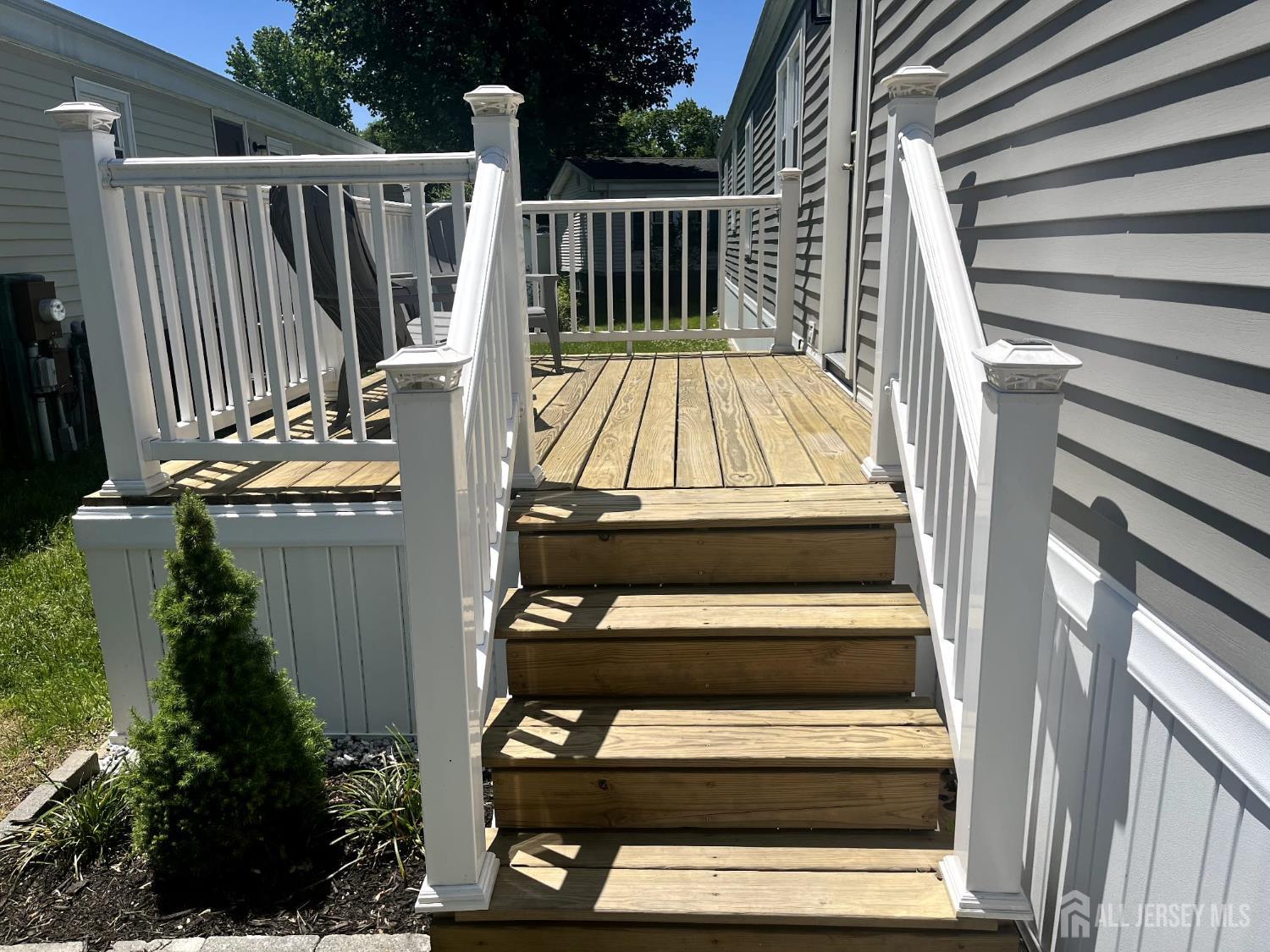 14 Byron Road North Brunswick, NJ 08902 - Photo 3 of 27 a view of deck with wooden floor and fence