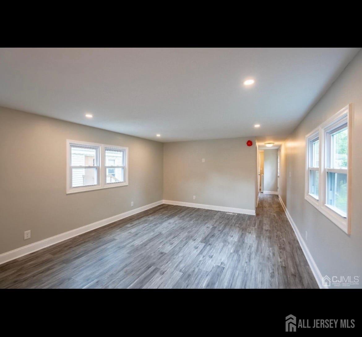 14 Byron Road North Brunswick, NJ 08902 - Photo 8 of 27 a open hall with wooden floor and windows