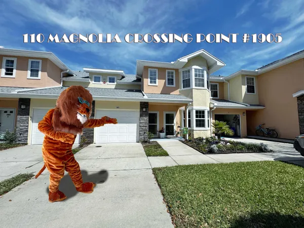 a view of a livingroom with wooden floor and stairs