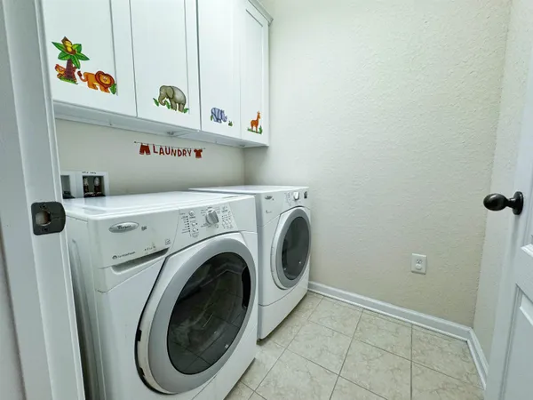 a view of a room with a ceiling fan